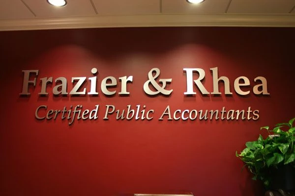 Frazier and Rhea dimensional reception sign with spacers to bring off the wall